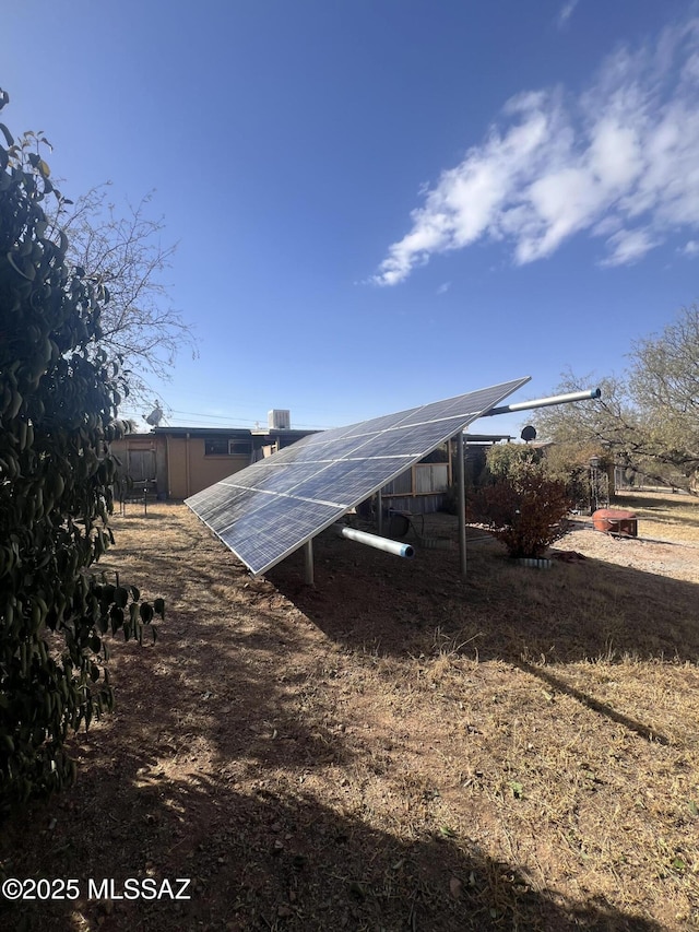 view of home's exterior featuring solar panels