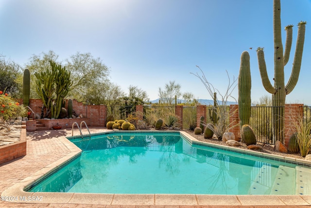 view of pool featuring a patio area