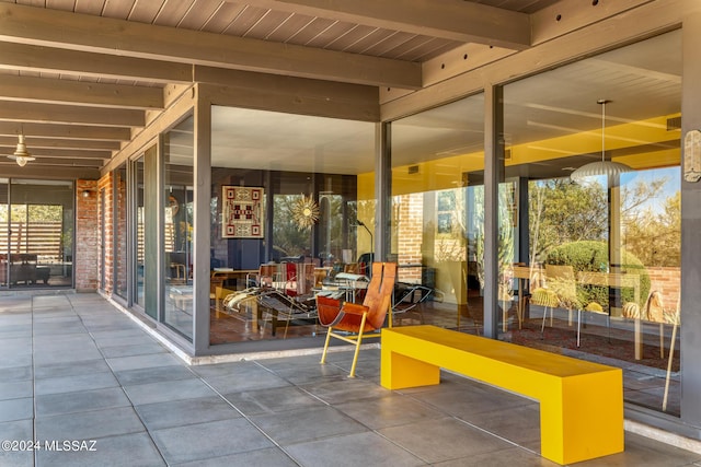 exterior space with beamed ceiling and wooden ceiling