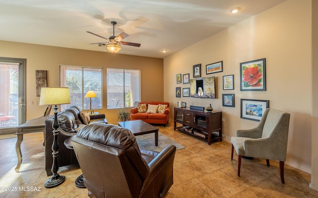 living room featuring ceiling fan and light tile patterned flooring