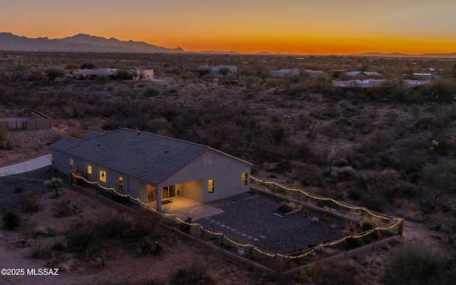 aerial view at dusk with a mountain view