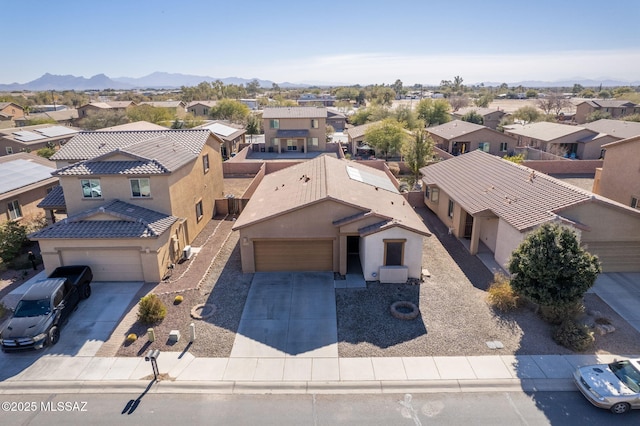 birds eye view of property with a mountain view