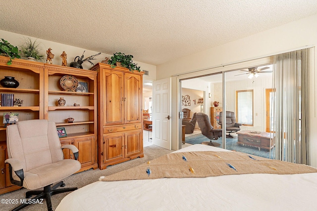 carpeted bedroom featuring a textured ceiling and a closet