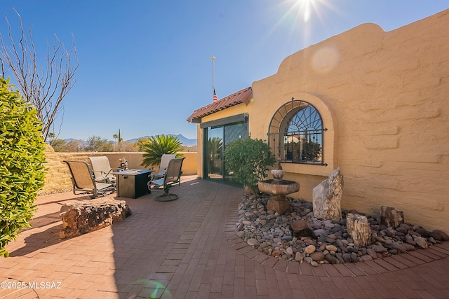 view of patio / terrace featuring an outdoor fire pit