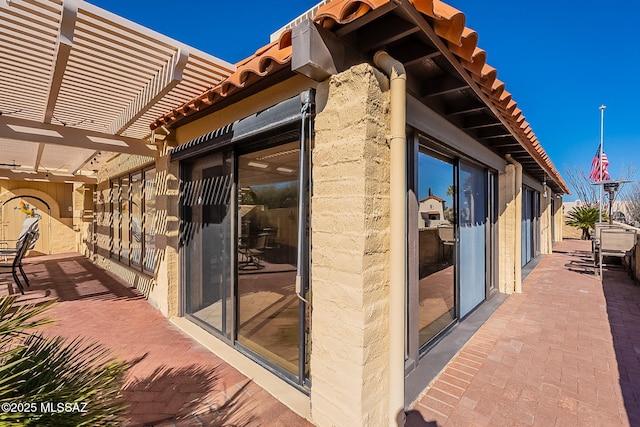 exterior space featuring a patio and a pergola