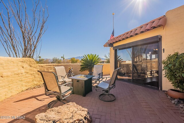 view of patio featuring a fire pit