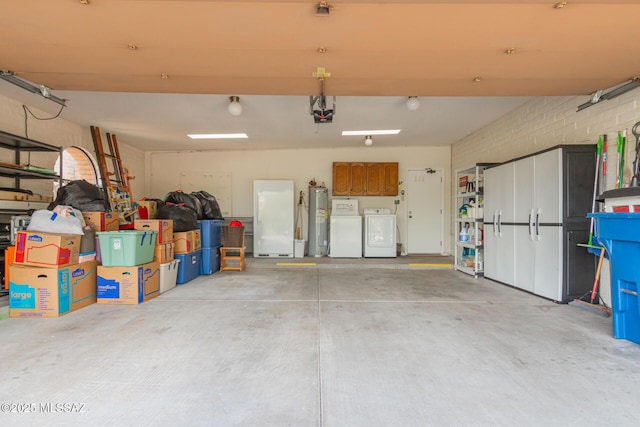 garage with independent washer and dryer, electric water heater, white refrigerator, and a garage door opener