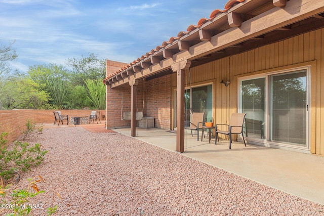 rear view of property featuring a patio