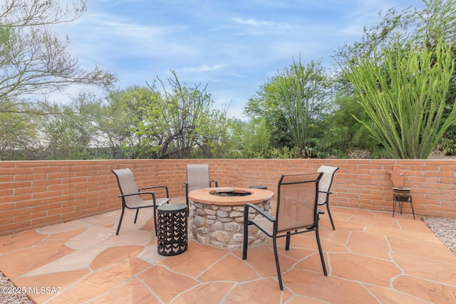 view of patio with an outdoor fire pit