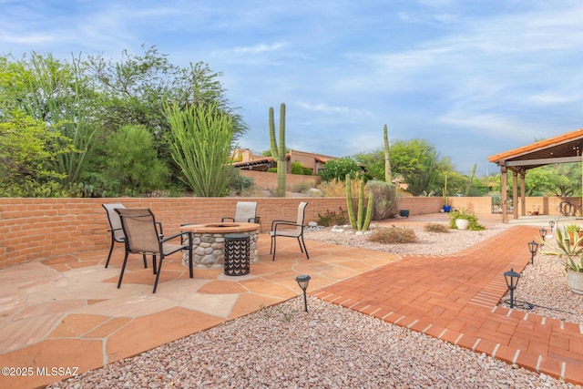 view of patio featuring an outdoor fire pit