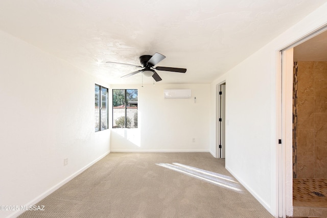 carpeted spare room with ceiling fan and a wall mounted AC