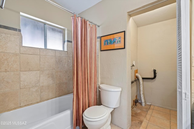 bathroom with shower / bath combo with shower curtain, tile patterned floors, and toilet