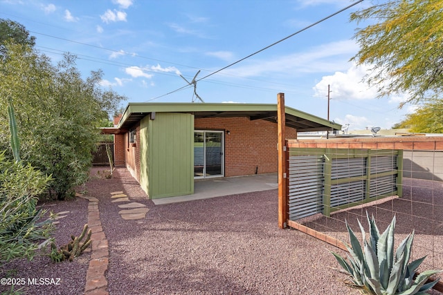 back of house with a patio