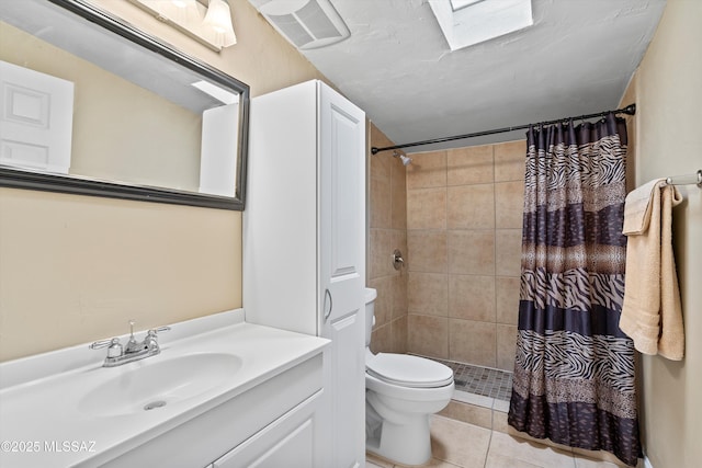 bathroom featuring curtained shower, toilet, vanity, and tile patterned flooring