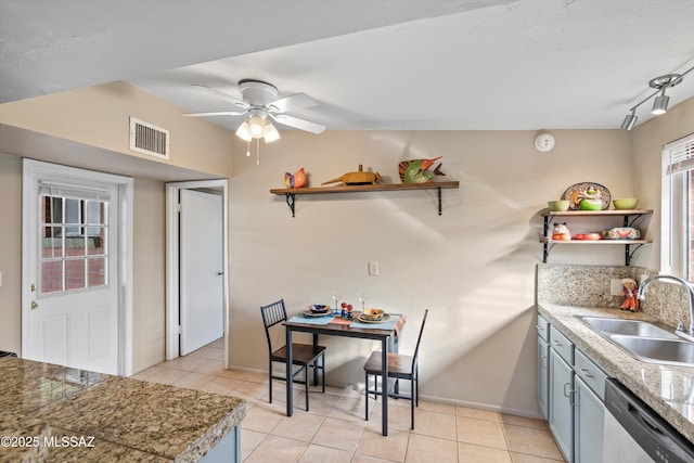 kitchen with ceiling fan, sink, stainless steel dishwasher, and light tile patterned flooring