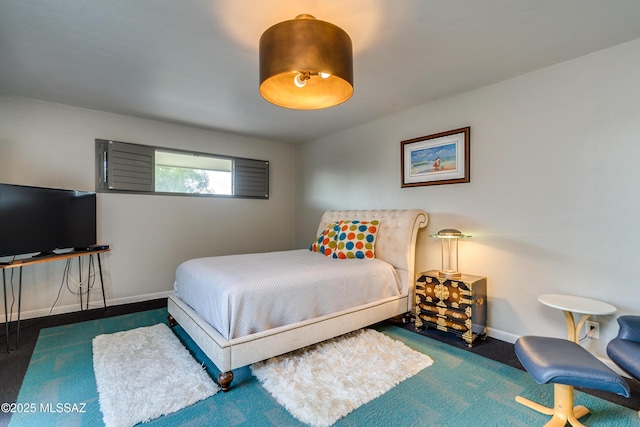 bedroom featuring dark carpet