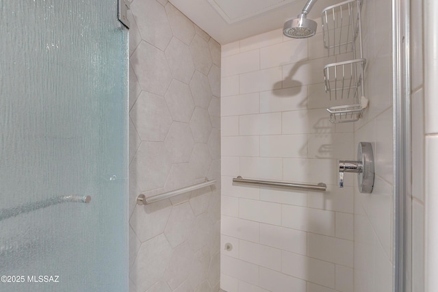 bathroom with tiled shower