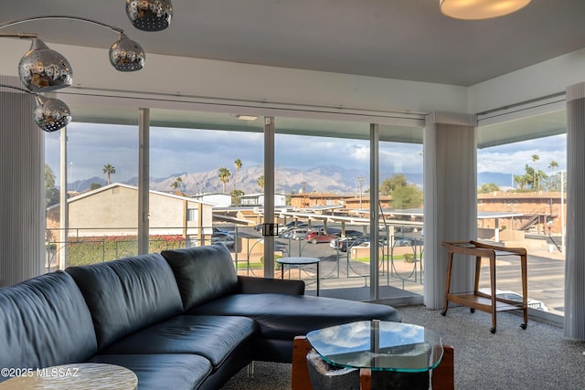 sunroom featuring a mountain view and a wealth of natural light