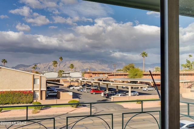 view of patio / terrace featuring a mountain view and a balcony