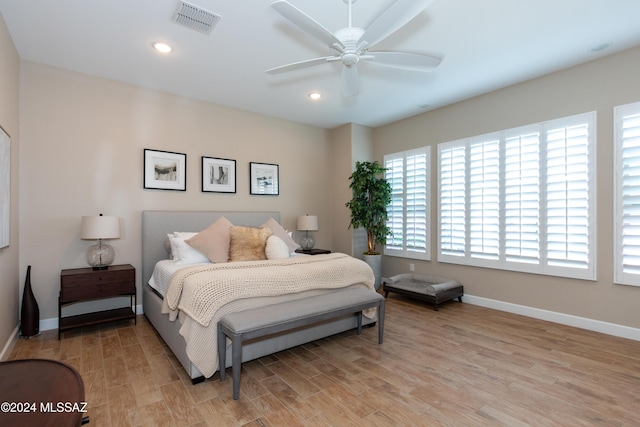 bedroom with light wood-type flooring and ceiling fan