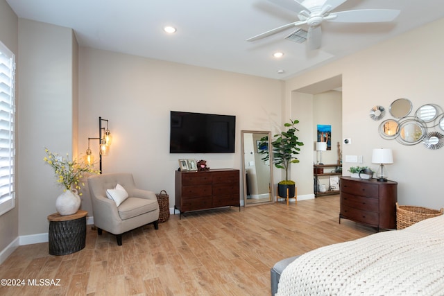 bedroom with ceiling fan and light hardwood / wood-style flooring