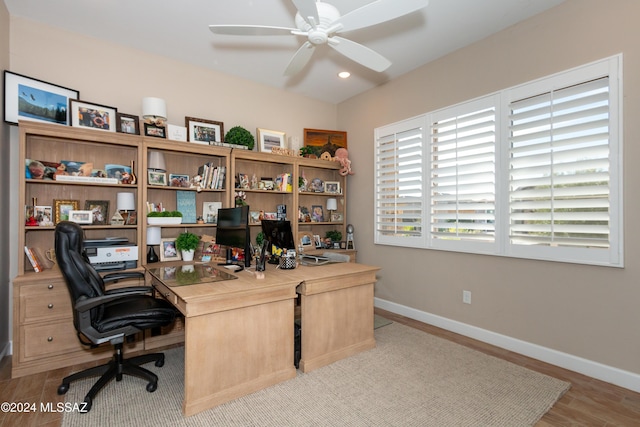 office area with ceiling fan and light hardwood / wood-style flooring