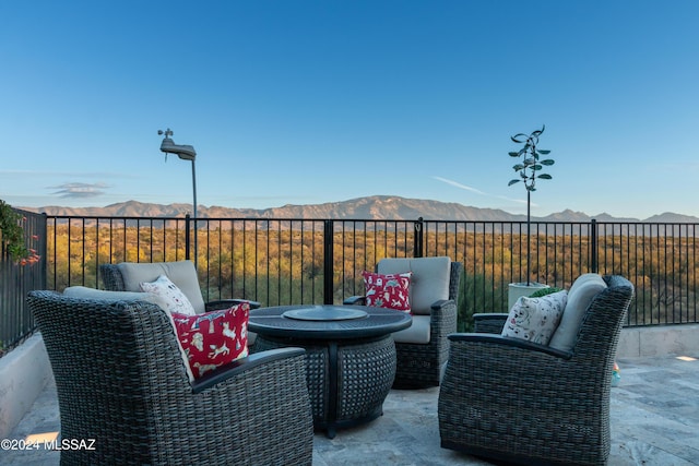 view of patio / terrace featuring a mountain view