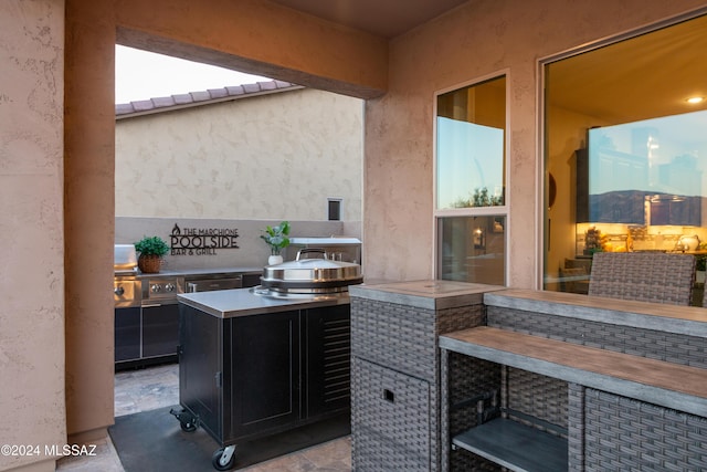 view of patio featuring exterior kitchen