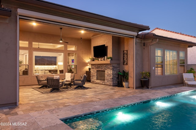 exterior space featuring an outdoor living space with a fireplace