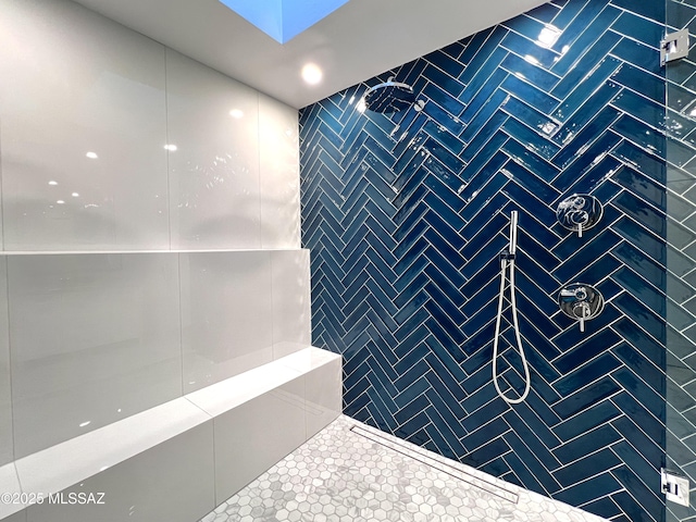 full bath with tiled shower, tile walls, and tile patterned floors