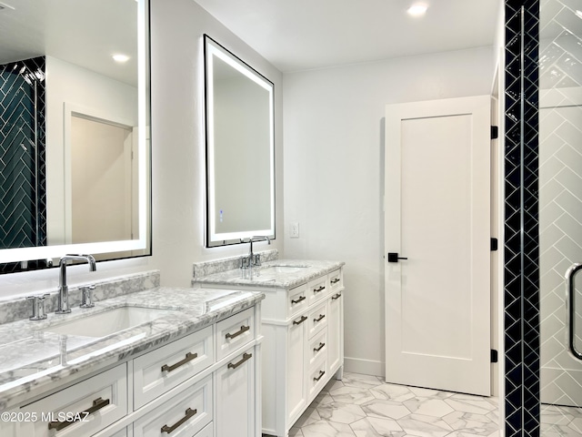 full bath featuring recessed lighting, marble finish floor, two vanities, and a sink