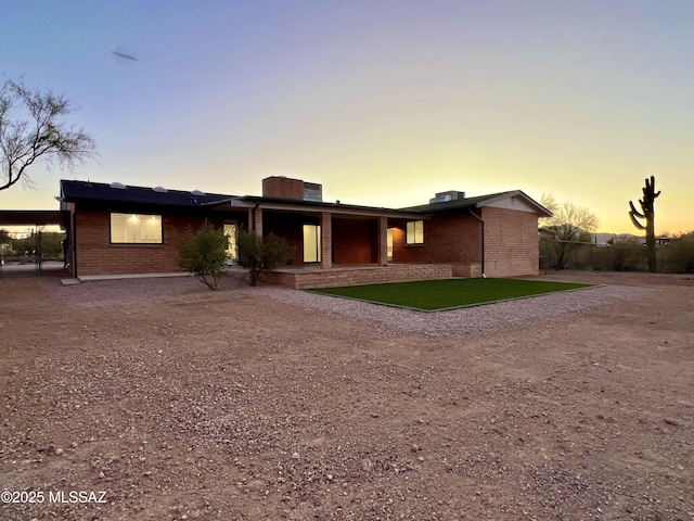 exterior space featuring brick siding