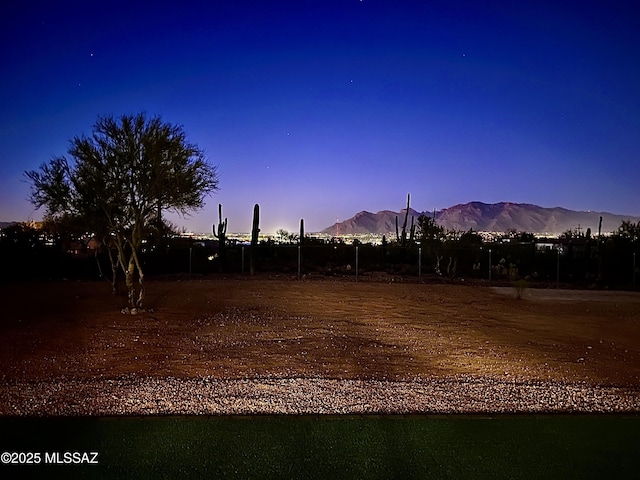 yard at dusk with a mountain view