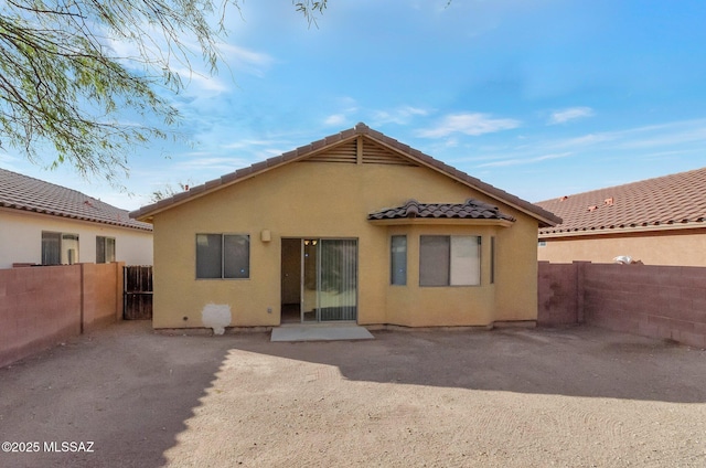 back of property with a patio area