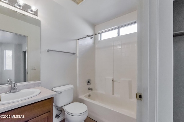 full bathroom with vanity, bathing tub / shower combination, and toilet