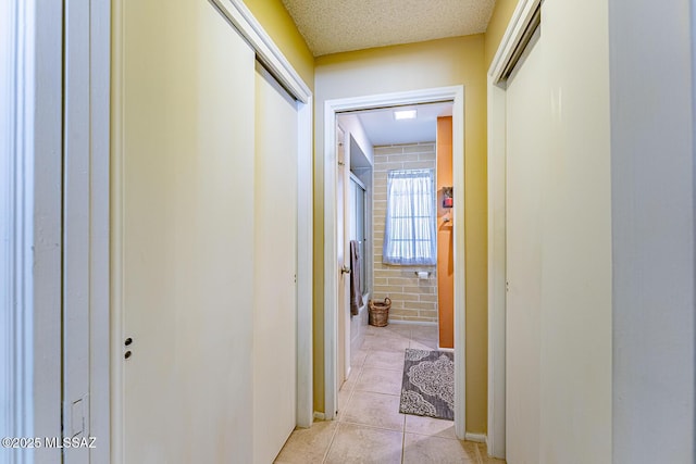 hallway featuring light tile patterned floors