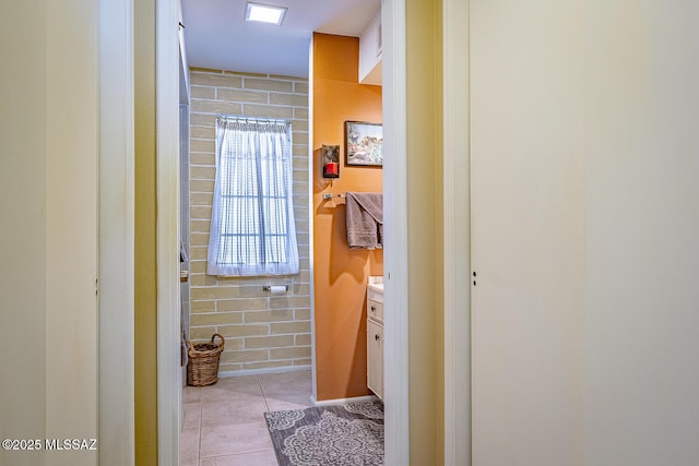 bathroom with tile patterned flooring and vanity