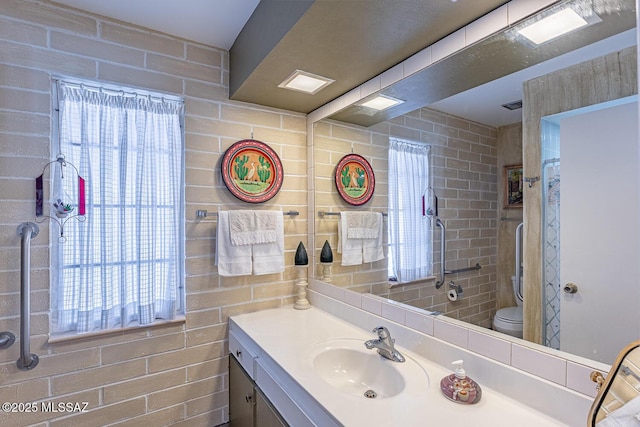 bathroom with vanity and toilet