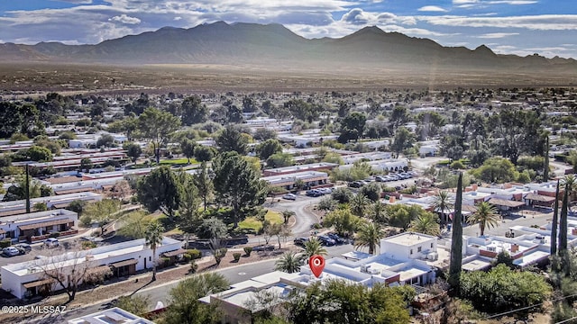 birds eye view of property with a mountain view