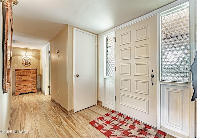 foyer with light wood-type flooring