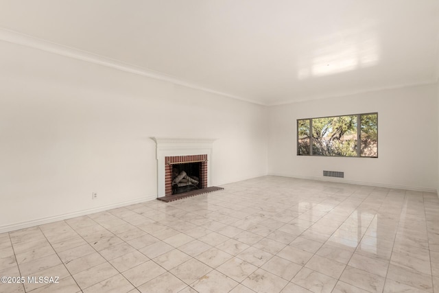 unfurnished living room with ornamental molding and a fireplace