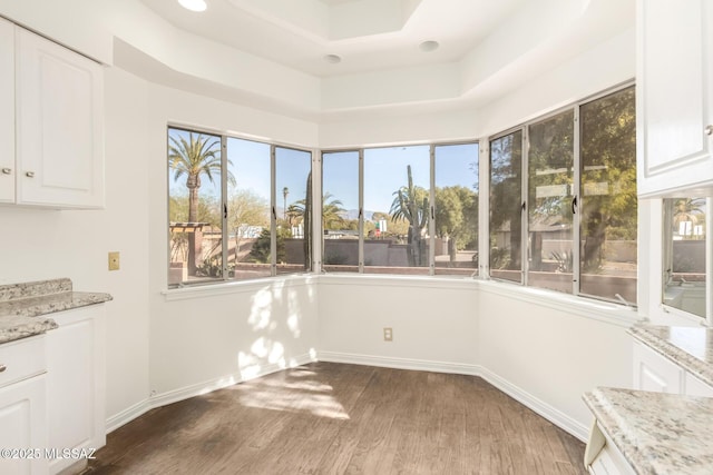 interior space with a tray ceiling