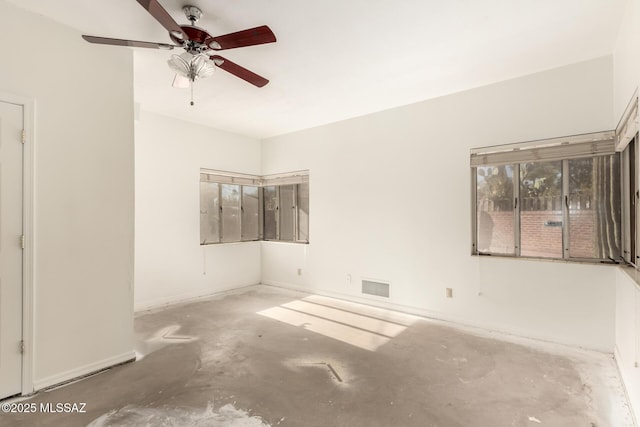 unfurnished room featuring concrete flooring and ceiling fan