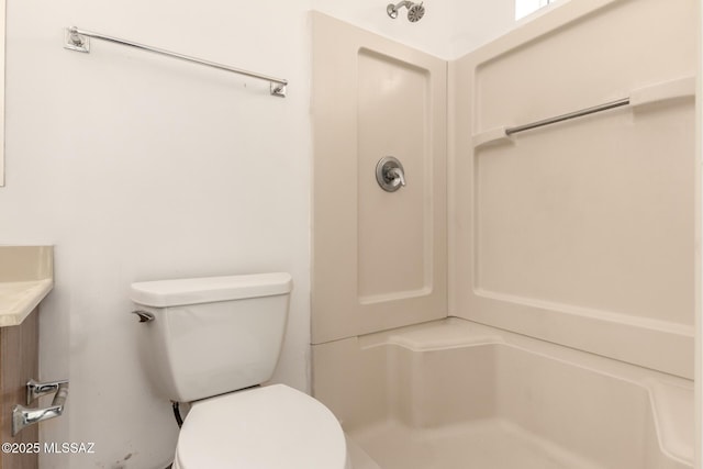 bathroom featuring a shower, vanity, and toilet