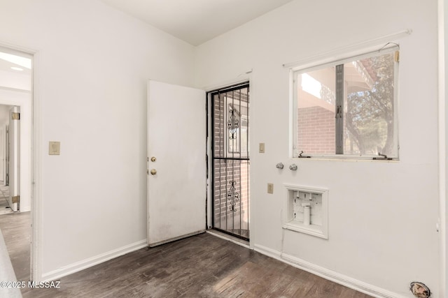 doorway with dark hardwood / wood-style flooring