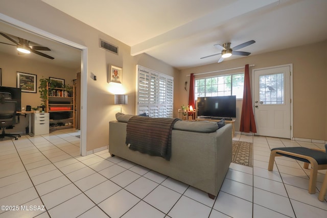 living room with light tile patterned floors, beam ceiling, and ceiling fan