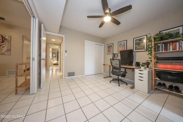 office with ceiling fan and light tile patterned flooring