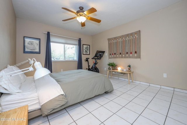 tiled bedroom with ceiling fan