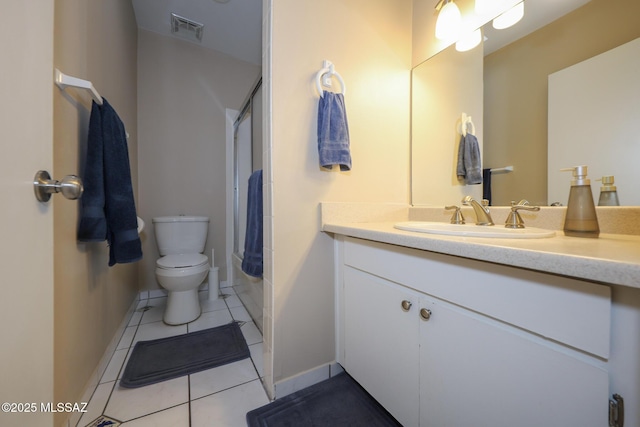 bathroom with tile patterned floors, vanity, and toilet