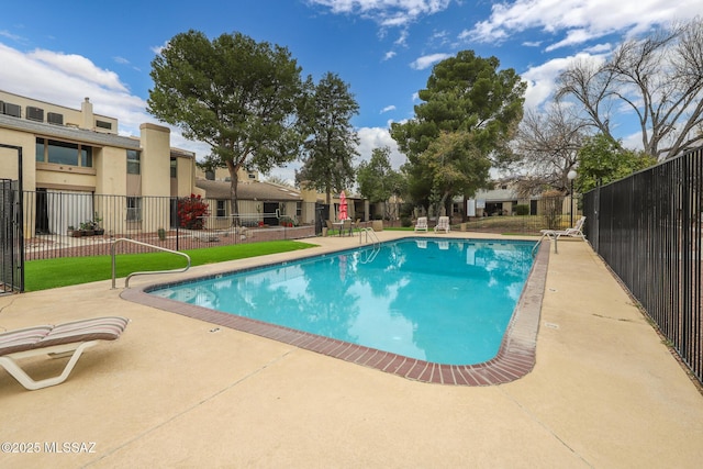 view of swimming pool with a patio area